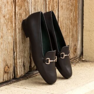 The Rose Ladies Slippers bring comfort and style together in black painted calf leather with a soft selwin lining. A forest-green sole adds a bold twist to this laid-back design. With their low profile and heel, they’re the perfect pair for effortless, everyday wear.